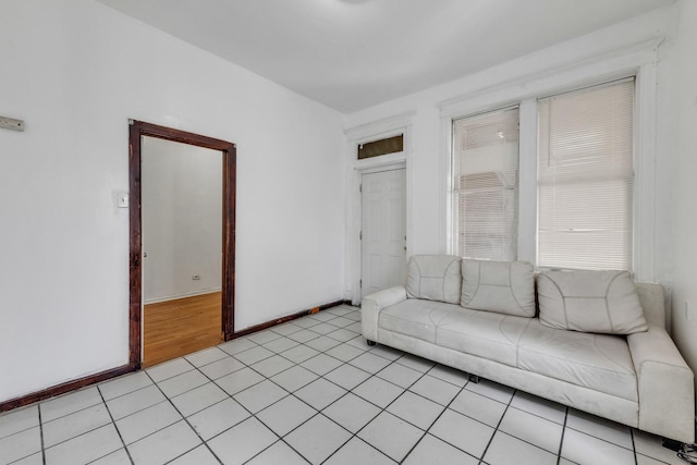 3031 S Central Park Ave, Chicago, IL 60623 - unfurnished living room featuring light tile patterned floors and baseboards