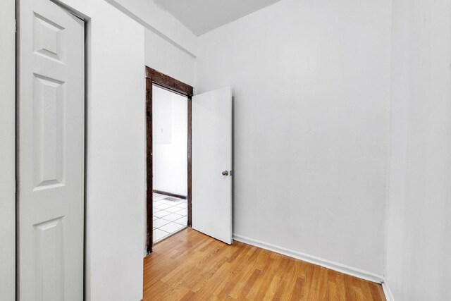 3031 S Central Park Ave, Chicago, IL 60623 - unfurnished bedroom with light wood-style flooring and baseboards