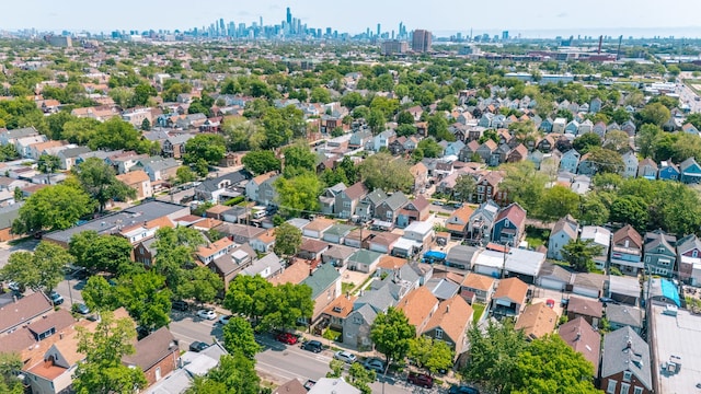 3031 S Central Park Ave, Chicago, IL 60623 - aerial view of property and surrounding area with city skyline and nearby suburban area