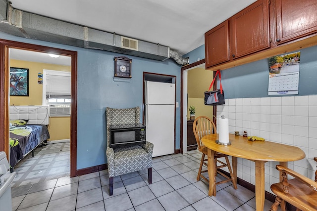 3031 S Central Park Ave, Chicago, IL 60623 - kitchen with freestanding refrigerator and black microwave
