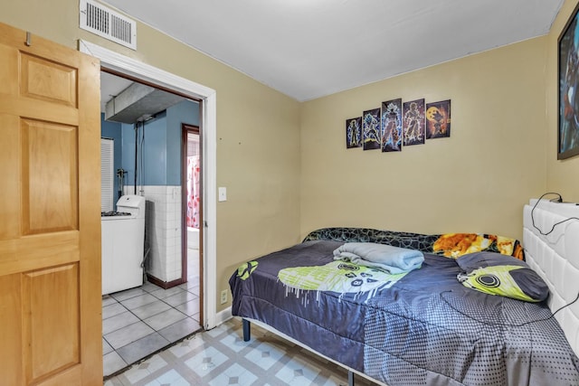 3031 S Central Park Ave, Chicago, IL 60623 - bedroom featuring washer / clothes dryer and light flooring