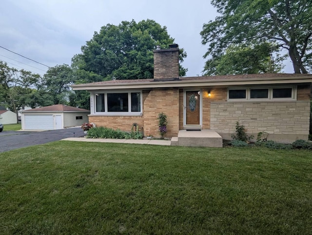 1906 Green Bay Rd, Zion, IL 60099 - single story home with a chimney, a front yard, a garage, and stone siding