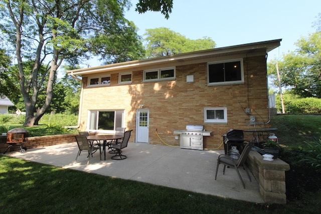 1906 Green Bay Rd, Zion, IL 60099 - rear view of house with a patio area and brick siding