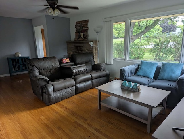 1906 Green Bay Rd, Zion, IL 60099 - living room with a ceiling fan, wood finished floors, and a fireplace