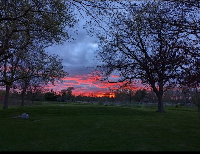 1906 Green Bay Rd, Zion, IL 60099 - yard at dusk featuring a yard