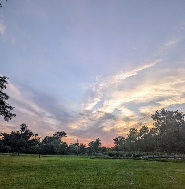 1906 Green Bay Rd, Zion, IL 60099 - yard at dusk with a view of countryside and a yard