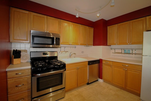 1906 Green Bay Rd, Zion, IL 60099 - kitchen with stainless steel appliances, light countertops, and decorative backsplash