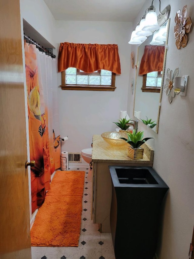 501 Fairview Ave, Rockford, IL 61108 - full bath with vanity, plenty of natural light, and a shower with curtain