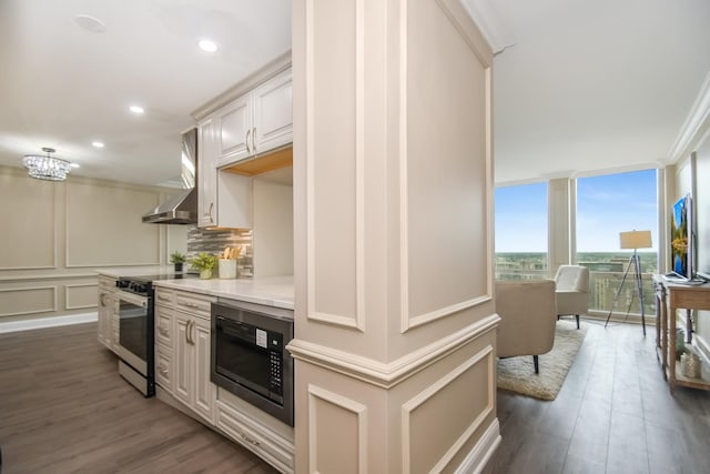 111 E Chestnut St Unit 4400J, Chicago, IL 60611 - kitchen featuring built in microwave, electric stove, wood finished floors, floor to ceiling windows, and recessed lighting