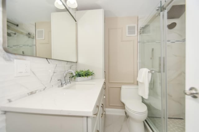 111 E Chestnut St Unit 4400J, Chicago, IL 60611 - bathroom featuring vanity, a stall shower, marble finish flooring, and tasteful backsplash