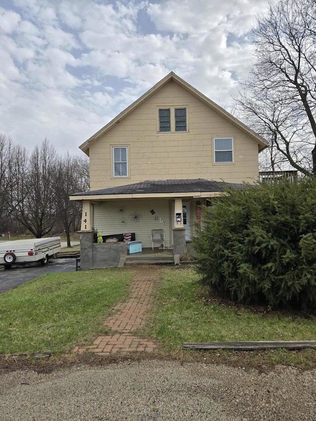 141 Short St, Crystal Lake, IL 60014 - back of house with covered porch and a lawn