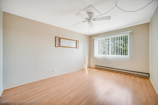 9716 S Karlov Ave S Unit 307, Oak Lawn, IL 60453 - empty room featuring a baseboard heating unit, wood finished floors, and a ceiling fan
