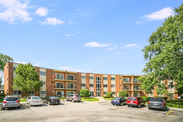 9716 S Karlov Ave S Unit 307, Oak Lawn, IL 60453 - view of apartment building / complex featuring uncovered parking