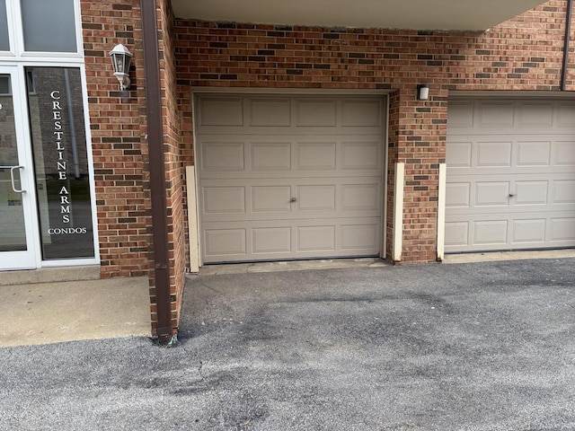 9716 S Karlov Ave S Unit 307, Oak Lawn, IL 60453 - garage featuring asphalt driveway