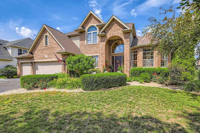 12740 Hawks Bill Ln, Plainfield, IL 60585 - traditional-style home with brick siding, a front lawn, driveway, and a shingled roof