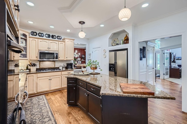 12740 Hawks Bill Ln, Plainfield, IL 60585 - kitchen with appliances with stainless steel finishes, ornamental molding, light wood-style flooring, tasteful backsplash, and decorative light fixtures