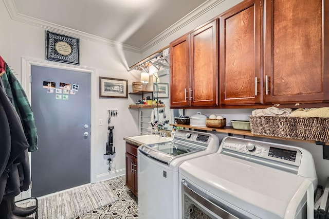 12740 Hawks Bill Ln, Plainfield, IL 60585 - laundry area with washing machine and clothes dryer, cabinet space, and ornamental molding