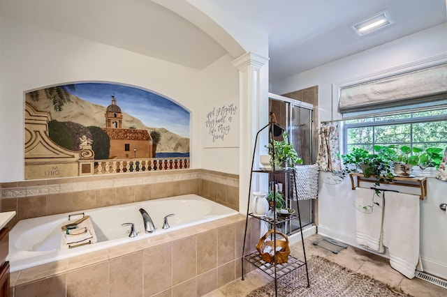 12740 Hawks Bill Ln, Plainfield, IL 60585 - full bathroom featuring a bath, a shower stall, decorative columns, and tile patterned floors