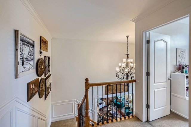 12740 Hawks Bill Ln, Plainfield, IL 60585 - hall featuring an upstairs landing, a chandelier, light colored carpet, and crown molding