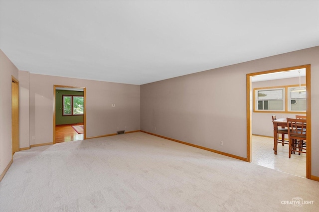 15418 S Pratt Ln, Plainfield, IL 60544 - unfurnished room featuring light carpet and baseboards