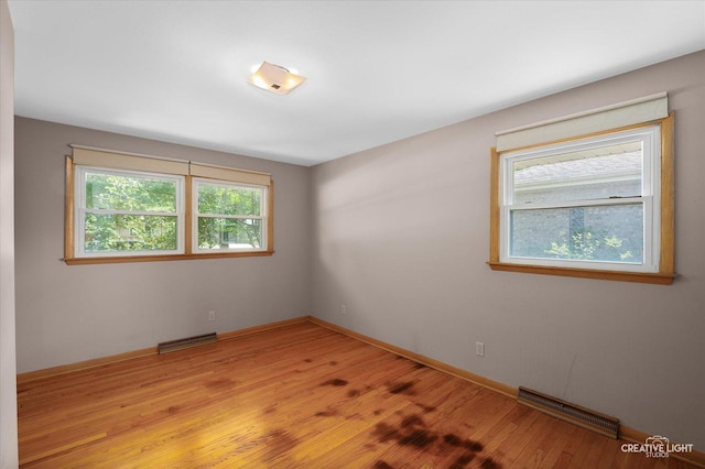 15418 S Pratt Ln, Plainfield, IL 60544 - spare room featuring light wood-style floors and baseboards