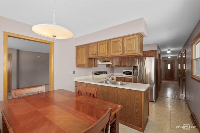 15418 S Pratt Ln, Plainfield, IL 60544 - kitchen featuring stainless steel fridge with ice dispenser, white microwave, under cabinet range hood, range, and light countertops