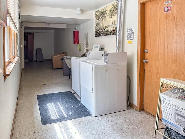 5457 W Edmunds St Unit 1A, Chicago, IL 60630 - laundry room featuring light flooring, washer and dryer, and cabinet space