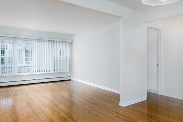 5457 W Edmunds St Unit 1A, Chicago, IL 60630 - spare room with baseboard heating and wood finished floors