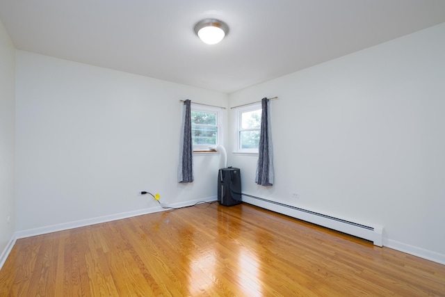 5457 W Edmunds St Unit 1A, Chicago, IL 60630 - unfurnished room featuring baseboard heating and light wood finished floors