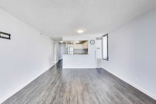 3660 N Lake Shore Dr Unit 3304, Chicago, IL 60613 - unfurnished living room with dark wood-type flooring and a textured ceiling