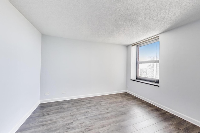 3660 N Lake Shore Dr Unit 3304, Chicago, IL 60613 - unfurnished room with wood finished floors and a textured ceiling
