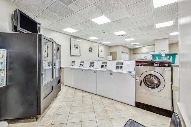 3660 N Lake Shore Dr Unit 3304, Chicago, IL 60613 - communal laundry room with estacked washer and dryer, light tile patterned flooring, and separate washer and dryer