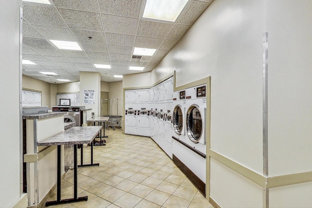 3660 N Lake Shore Dr Unit 3304, Chicago, IL 60613 - shared laundry with washing machine and dryer and light tile patterned flooring
