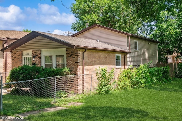 6545 S Hamilton Ave, Chicago, IL 60636 - view of home's exterior featuring brick siding and roof with shingles