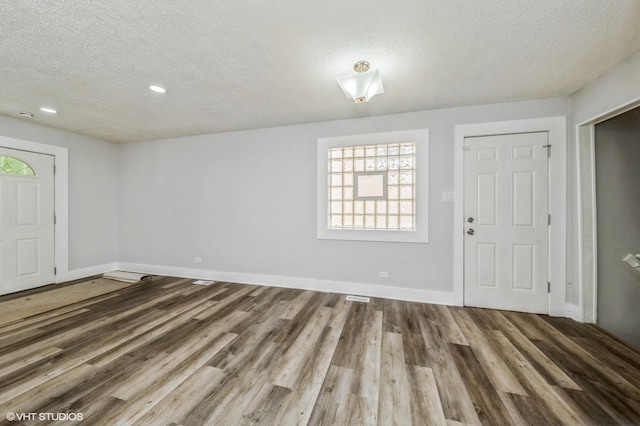 6545 S Hamilton Ave, Chicago, IL 60636 - entrance foyer with a textured ceiling, wood finished floors, plenty of natural light, and recessed lighting