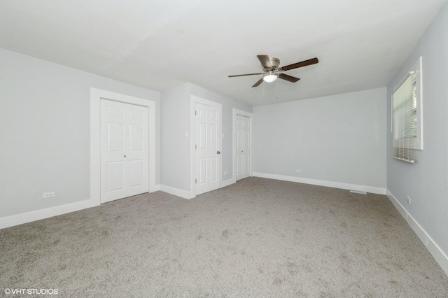 6545 S Hamilton Ave, Chicago, IL 60636 - unfurnished bedroom featuring carpet floors, two closets, and a ceiling fan