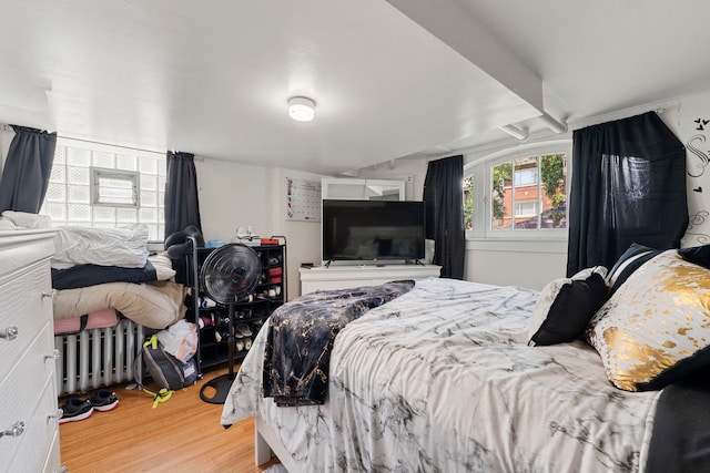 5121 W Henderson Ave, Chicago, IL 60641 - bedroom featuring light wood-type flooring and radiator heating unit