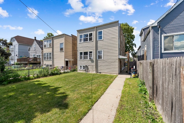 5121 W Henderson Ave, Chicago, IL 60641 - rear view of property featuring a fenced backyard and a residential view