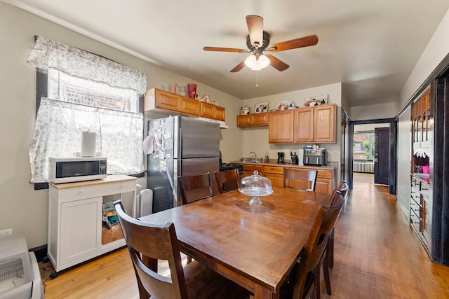 5121 W Henderson Ave, Chicago, IL 60641 - dining space featuring ceiling fan and light wood-style flooring
