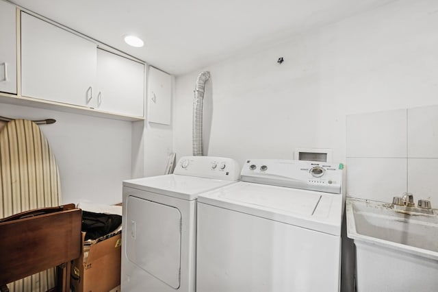 9519 Kolmar Ave, Skokie, IL 60076 - laundry area featuring separate washer and dryer and cabinet space