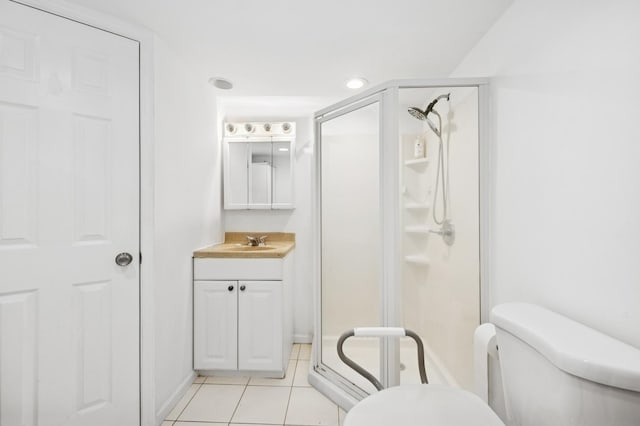 9519 Kolmar Ave, Skokie, IL 60076 - full bathroom with a shower stall, vanity, and tile patterned floors