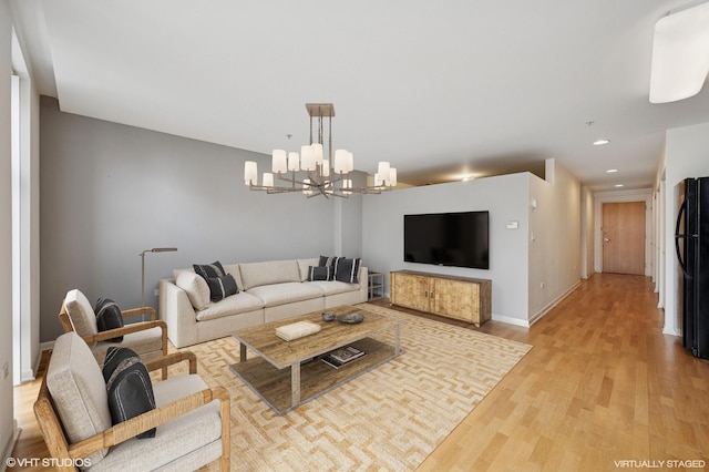 1740 Oak Ave Unit 103, Evanston, IL 60201 - living room featuring light wood finished floors, recessed lighting, and a chandelier