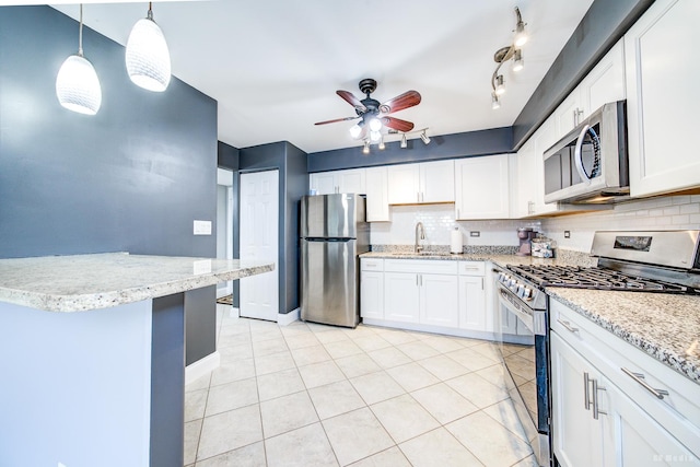 14620 Scarborough Ct Unit M2, Oak Forest, IL 60452 - kitchen featuring stainless steel appliances, backsplash, a ceiling fan, and white cabinets