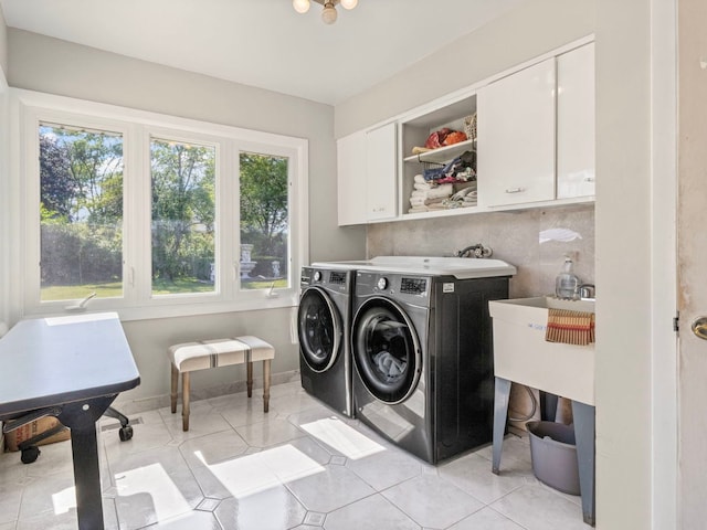 922 S School St, Mount Prospect, IL 60056 - laundry area with cabinet space, washing machine and clothes dryer, and light tile patterned floors