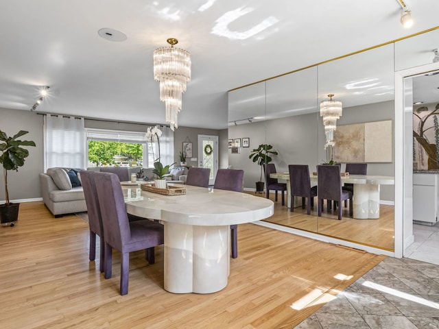 922 S School St, Mount Prospect, IL 60056 - dining space with a chandelier and wood finished floors