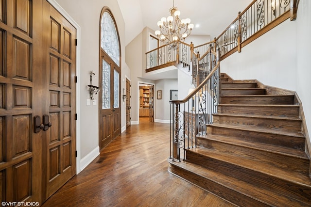 32W634 Oak Lawn Farm Rd, Wayne, IL 60184 - foyer featuring stairway, dark wood-style flooring, high vaulted ceiling, and a chandelier