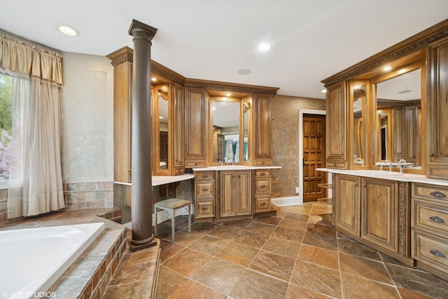 32W634 Oak Lawn Farm Rd, Wayne, IL 60184 - bathroom with ornate columns, stone tile floors, two vanities, and a garden tub