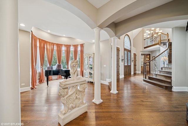 32W634 Oak Lawn Farm Rd, Wayne, IL 60184 - entryway with ornate columns, arched walkways, recessed lighting, wood finished floors, and a chandelier