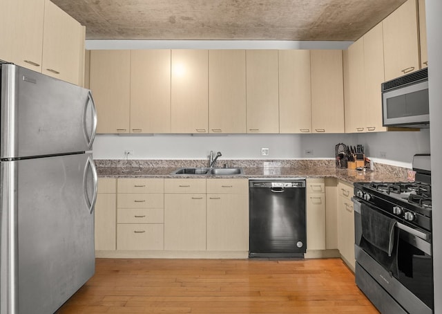 1845 S Michigan Ave Unit 701, Chicago, IL 60616 - kitchen with stainless steel appliances, light wood-style floors, light stone countertops, and light brown cabinetry