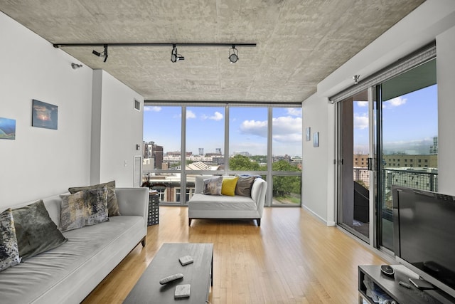 1845 S Michigan Ave Unit 701, Chicago, IL 60616 - living room with rail lighting, light wood finished floors, plenty of natural light, and floor to ceiling windows